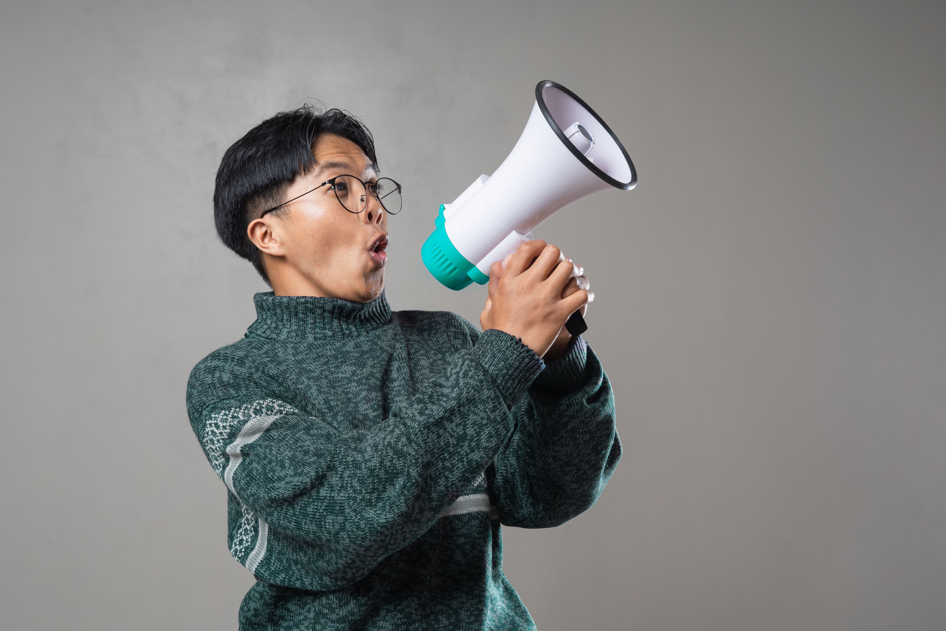 A person making an announcement through a megaphone