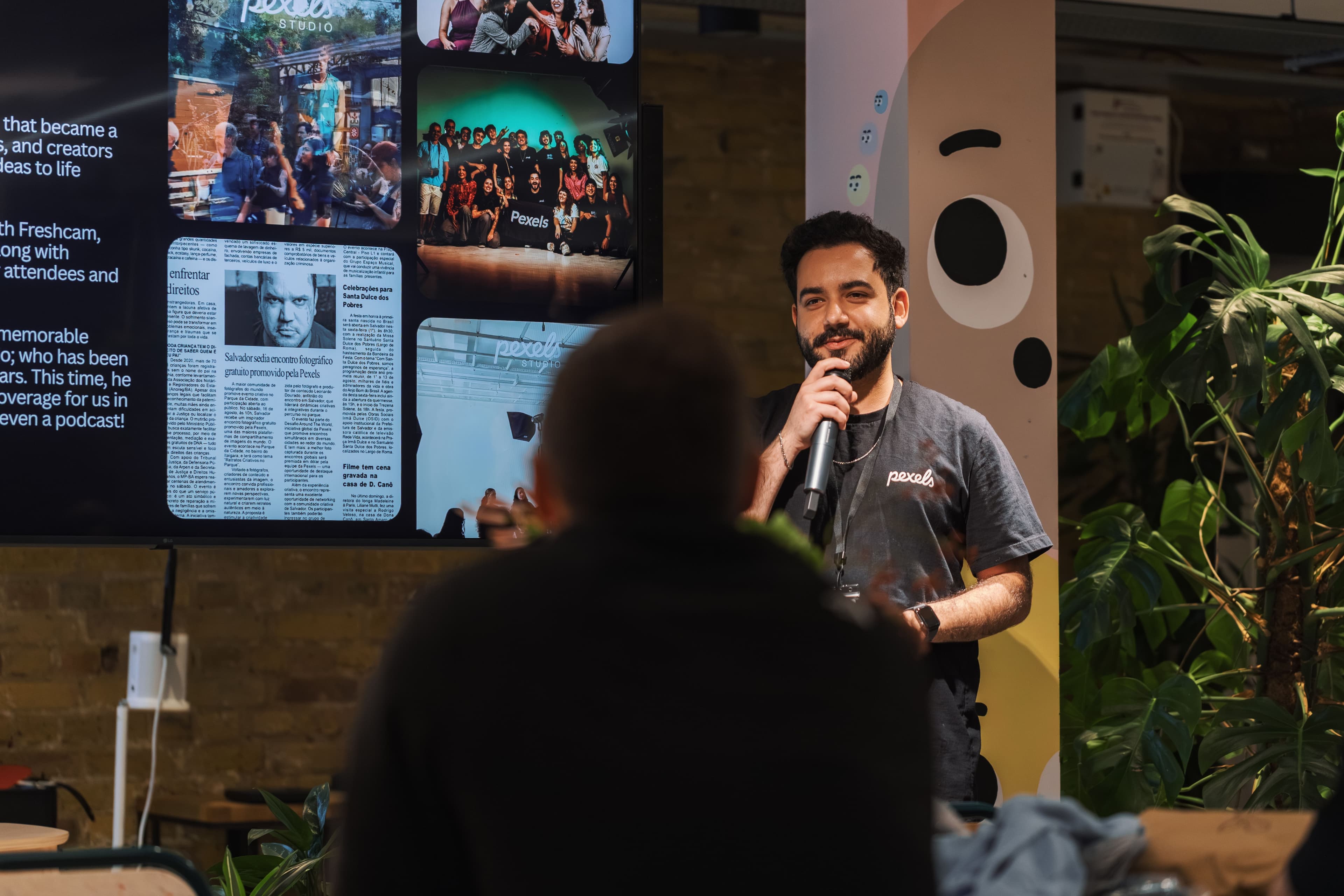 A presenter speaking to a group during a session
