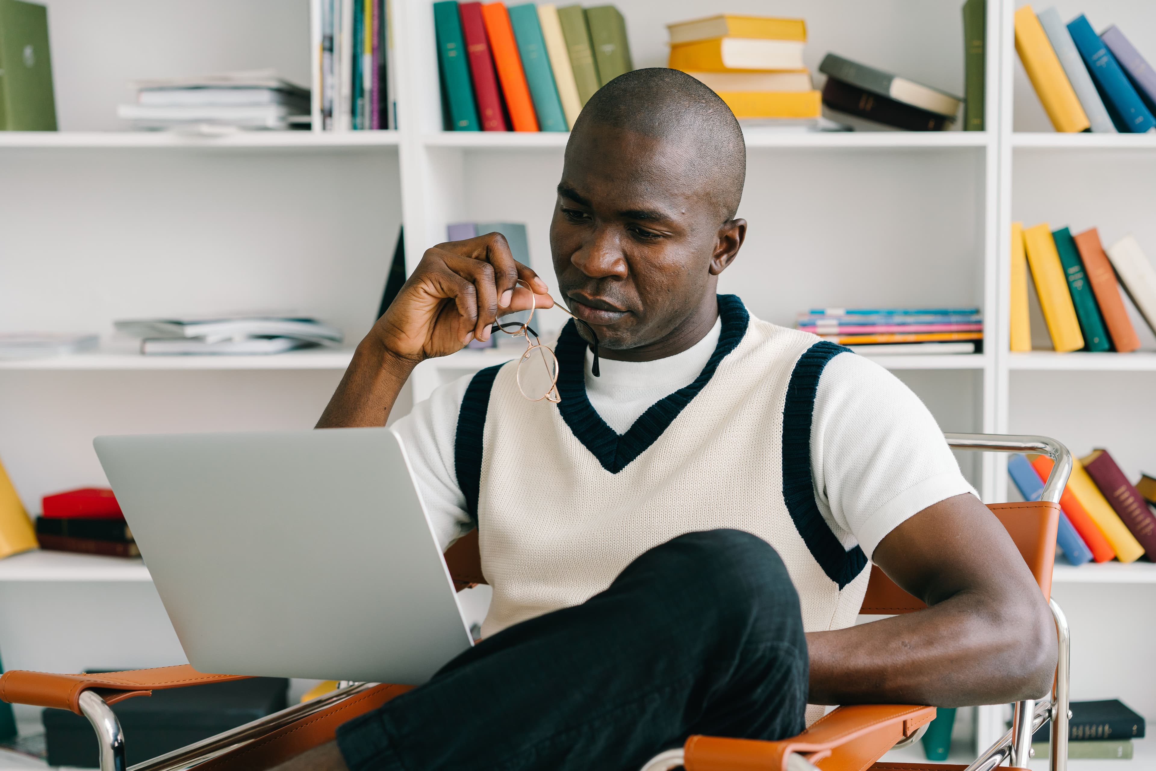 Someone reviewing material on a laptop